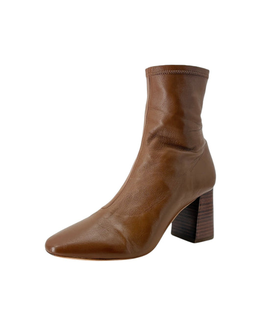 Brown ankle boot with a block heel on a white background