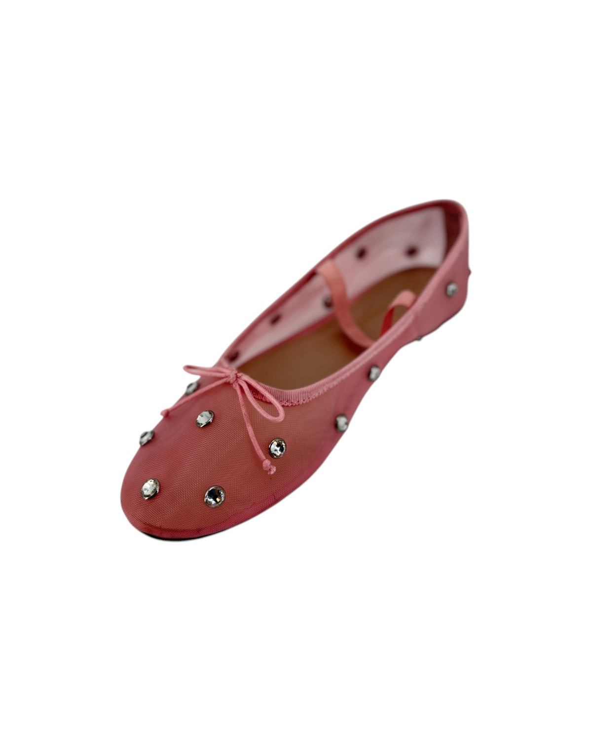 Pink ballet flats with attached jewels and an elastic strap across the top on a white bacground