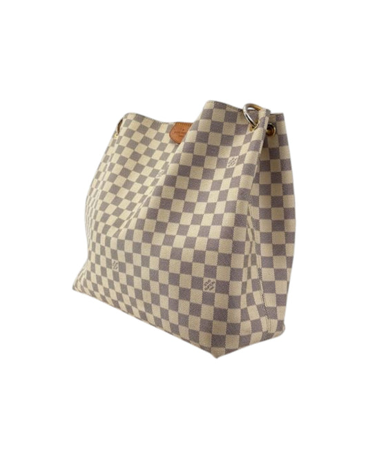 Checkered handbag with visible brand logo on a white background