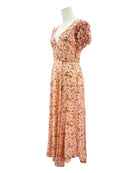 Floral dress on a mannequin against a white background