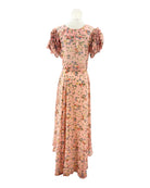 Floral dress on a mannequin against a white background