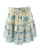 Loveshackfancy floral tiered mini skirt with blue flowers on a white background