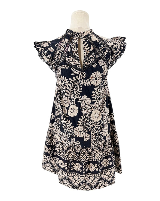 A navy blue and cream floral print dress displayed on a mannequin torso against a plain white background.