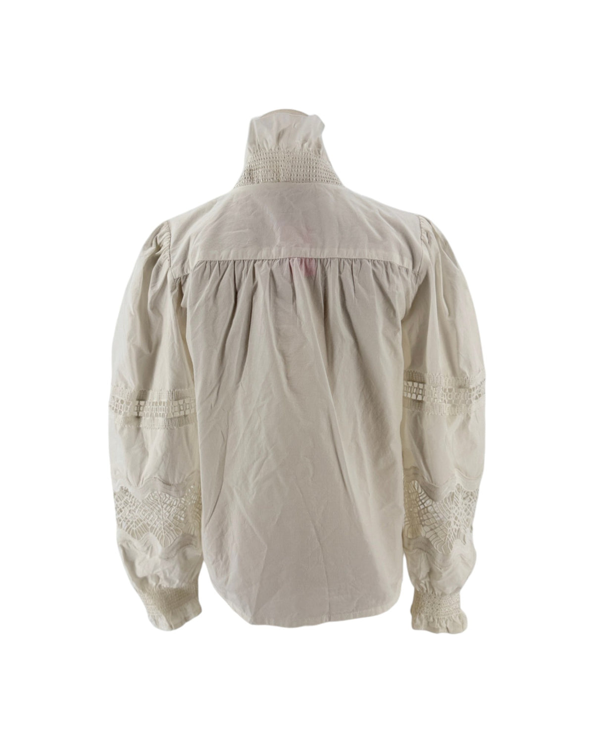 White long sleeve blouse with a ruffle collar and eyelet detailing on the sleeves on a mannequin on a white background