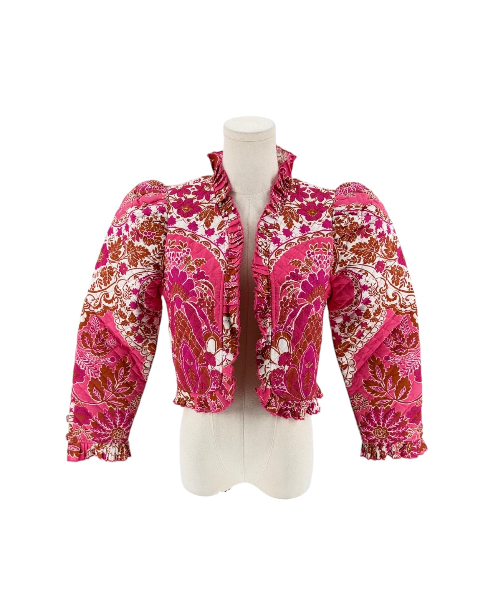 Long sleeve floral pink quilted jacket with ruffle trim on a white background