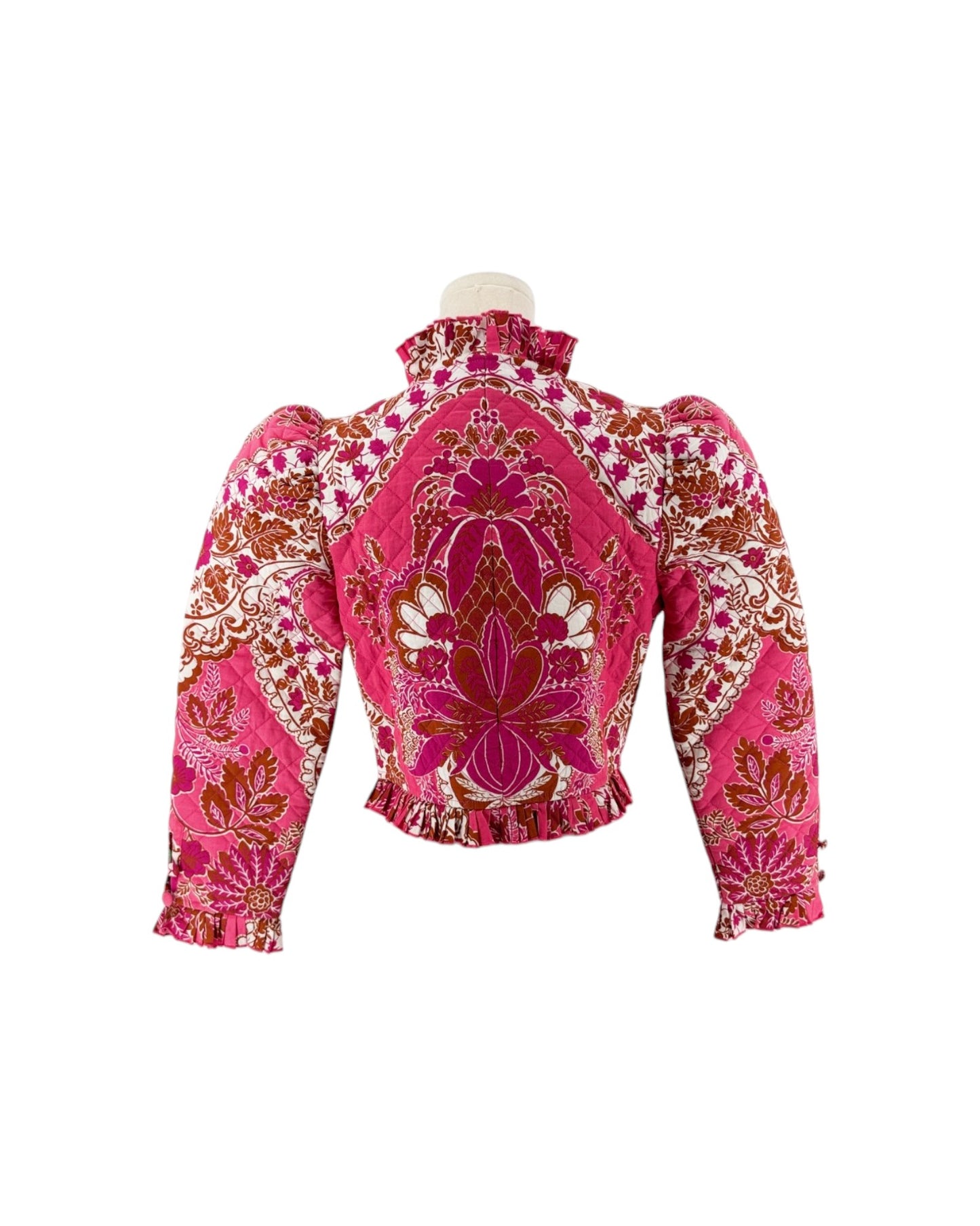 Long sleeve floral pink quilted jacket with ruffle trim on a white background