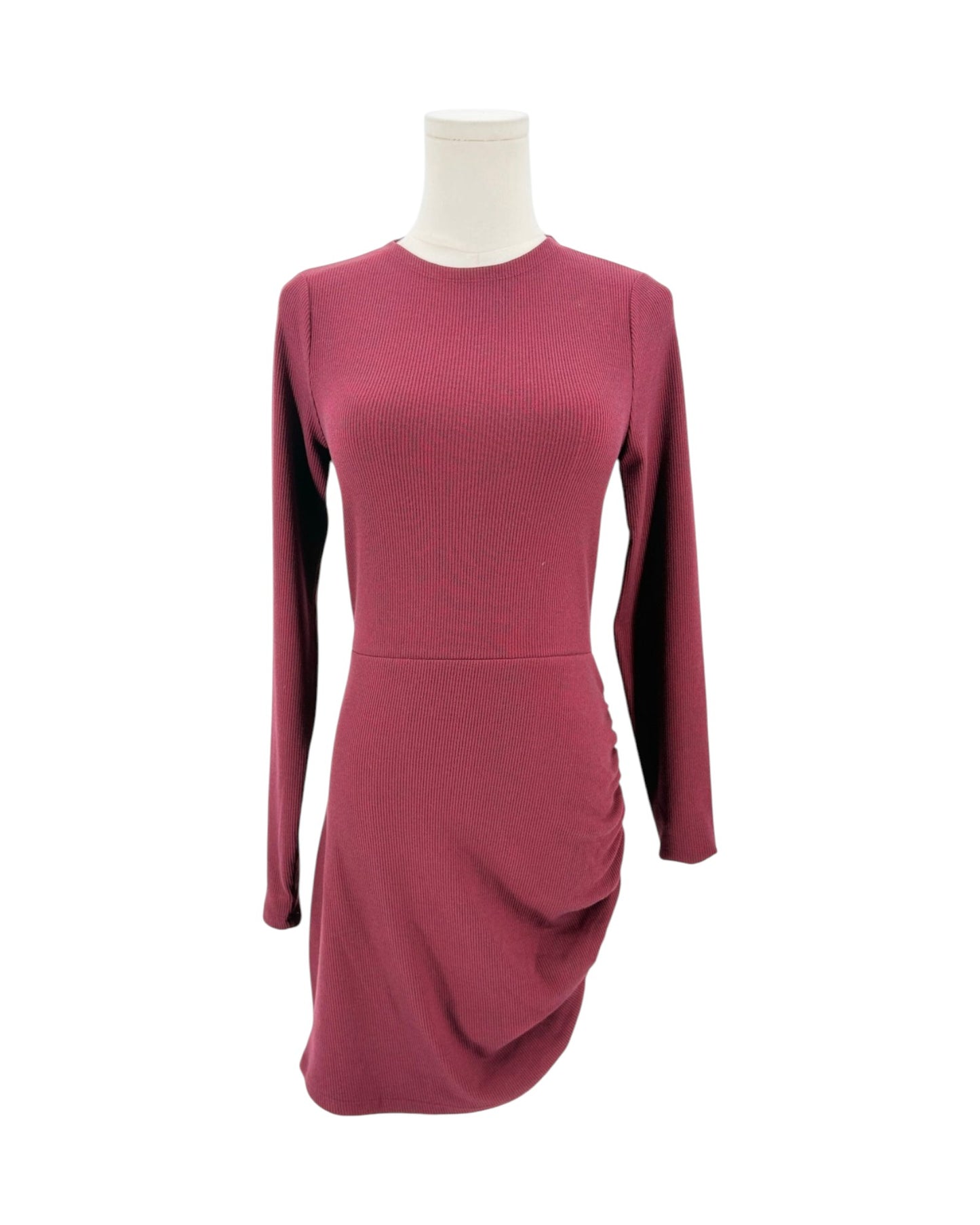A long-sleeve ribbed knit mini dress in a dusty rose or mauve color, displayed on a headless mannequin torso against a plain white background.