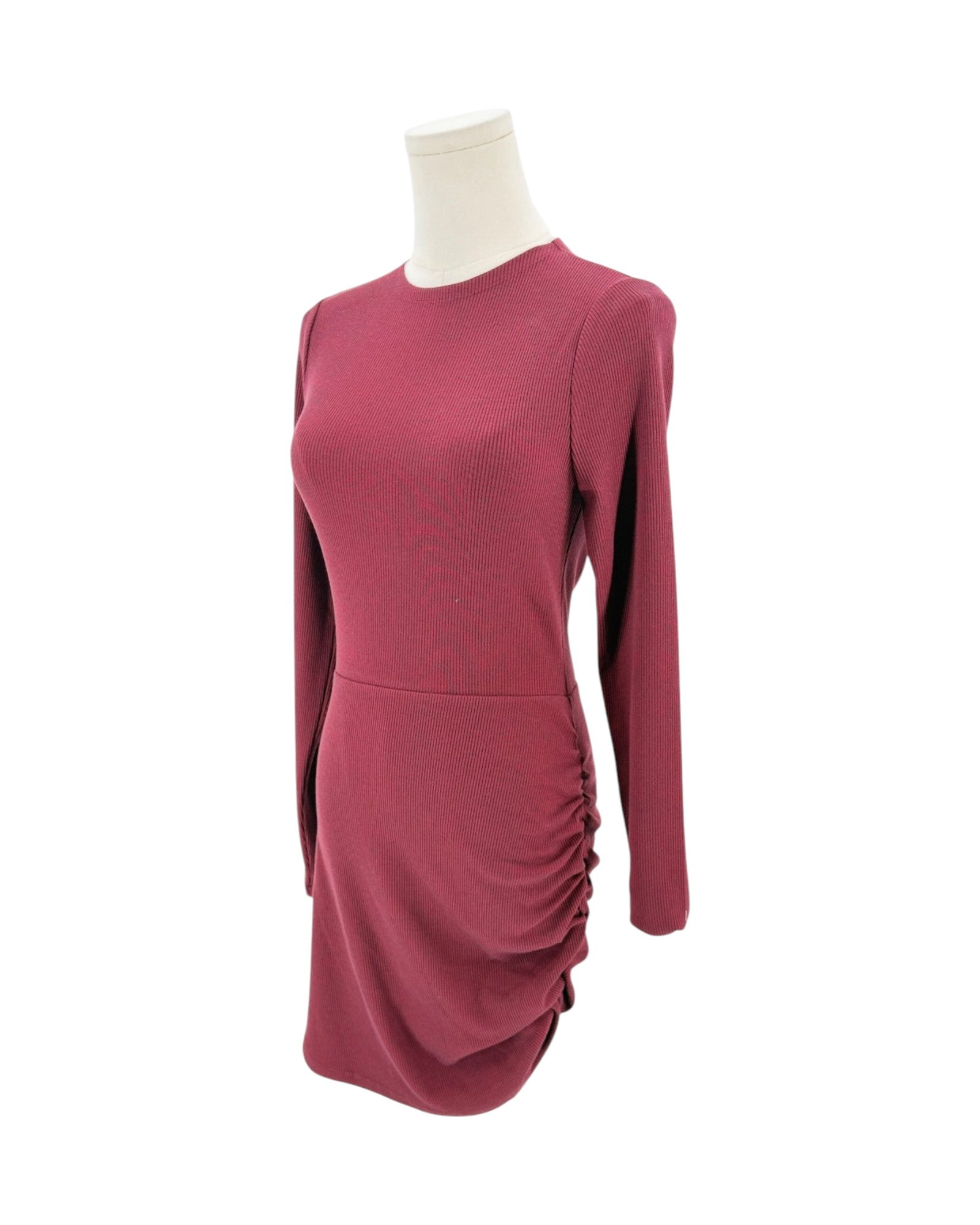 A long-sleeve, crew-neck knit dress in a dusty rose or mauve color, displayed on a white mannequin torso against a plain white background.