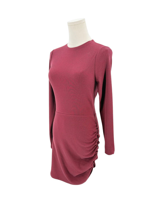 A long-sleeve, crew-neck knit dress in a dusty rose or mauve color, displayed on a white mannequin torso against a plain white background.