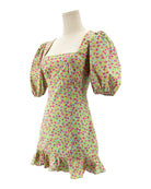 Floral dress on a mannequin against a white background