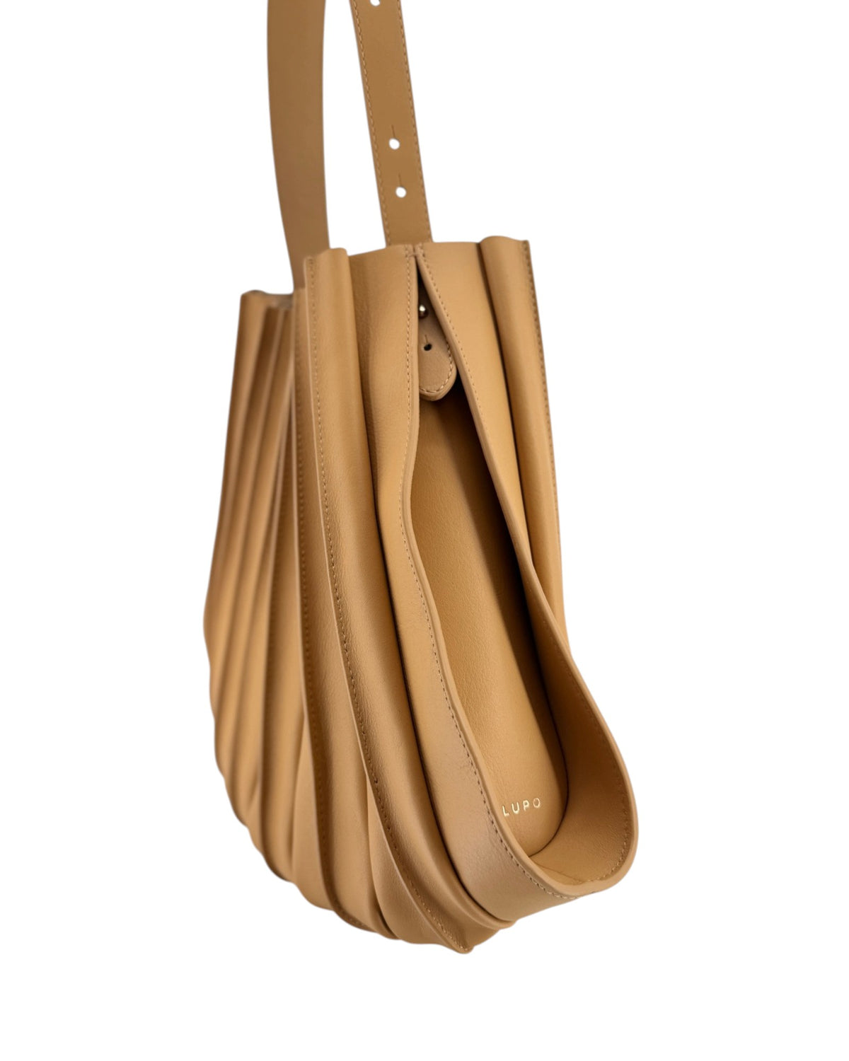 Tan pleated leather handbag on a white background