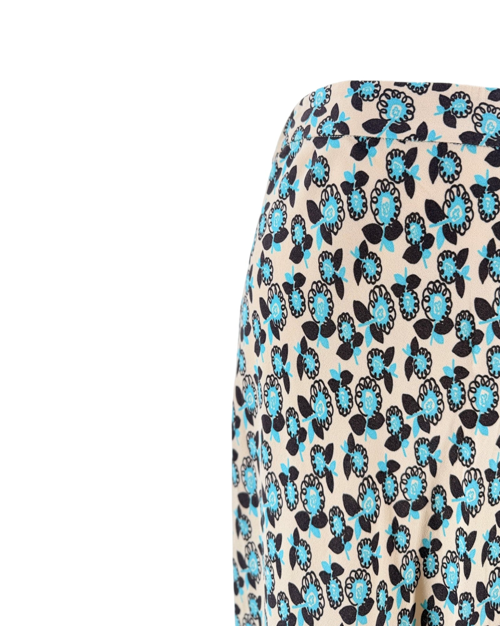 Skirt with blue and black floral pattern on a beige background