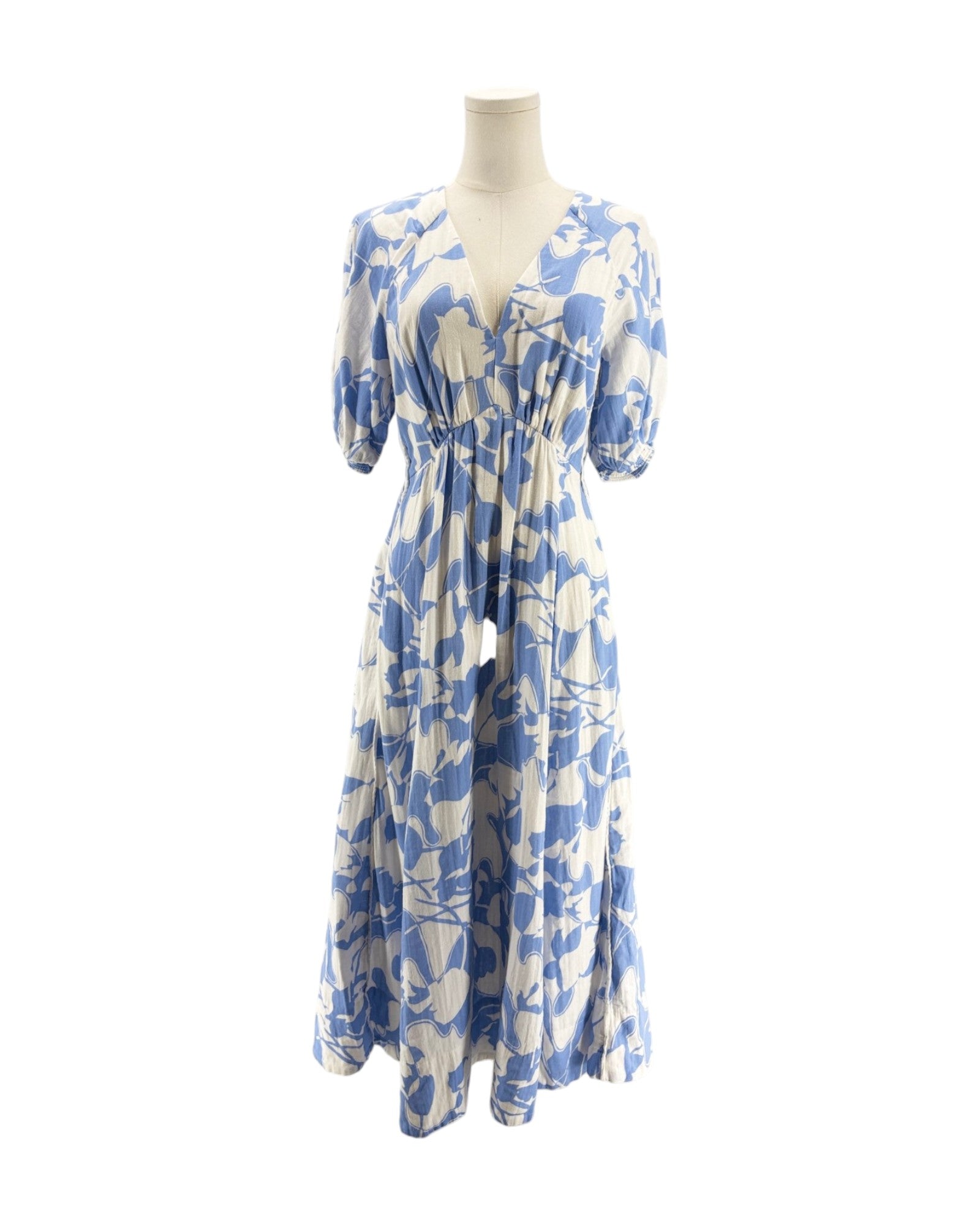 Blue and white floral dress on a mannequin against a white background