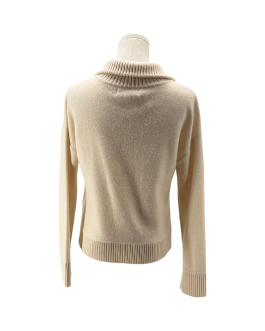 A beige knit sweater with a ribbed mock neck, long sleeves, and a ribbed hem and cuffs, displayed on a mannequin torso against a white background.