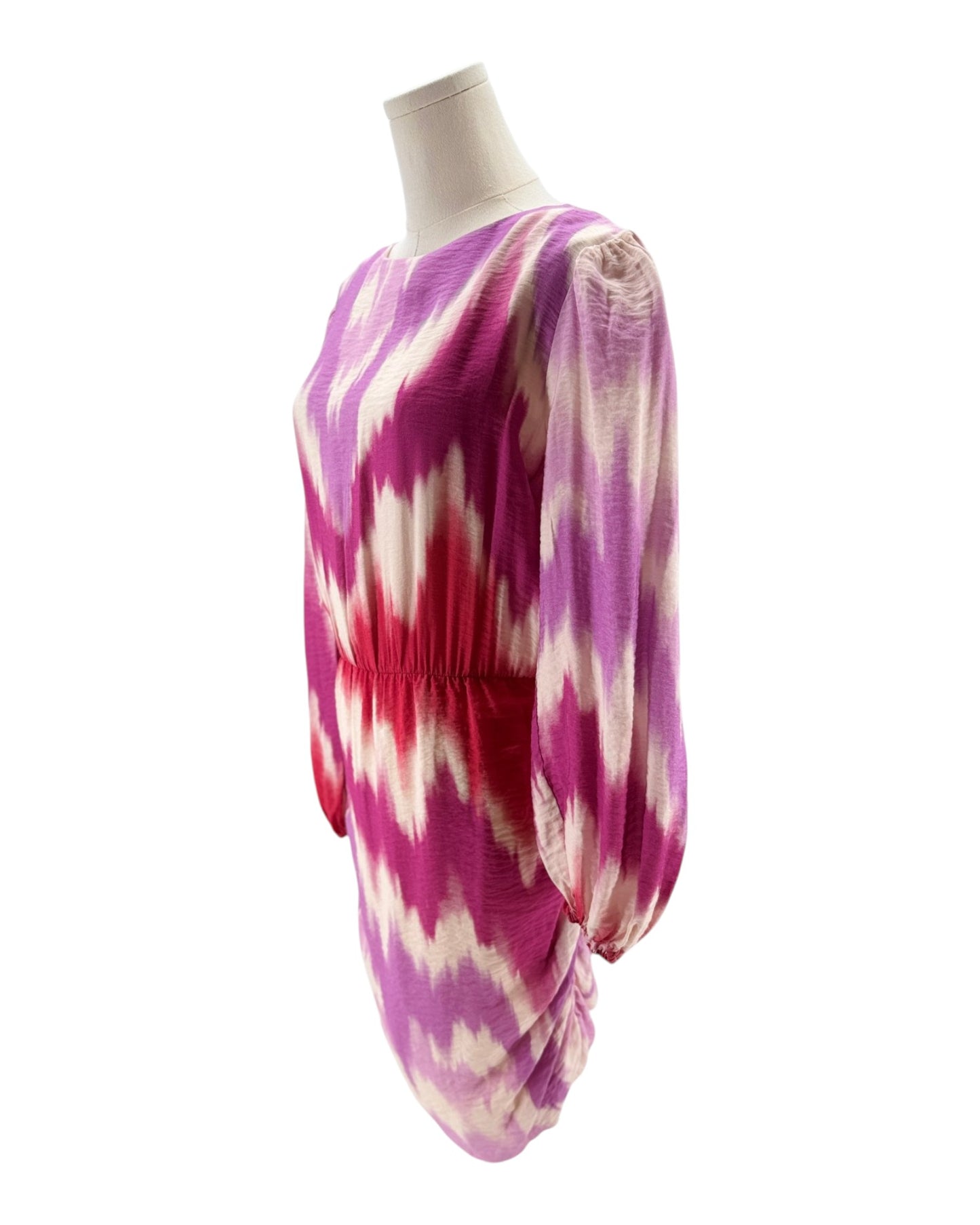 Tie-dye dress on a mannequin against a white background