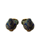 Pair of blue and gold patterned shoes on a white background