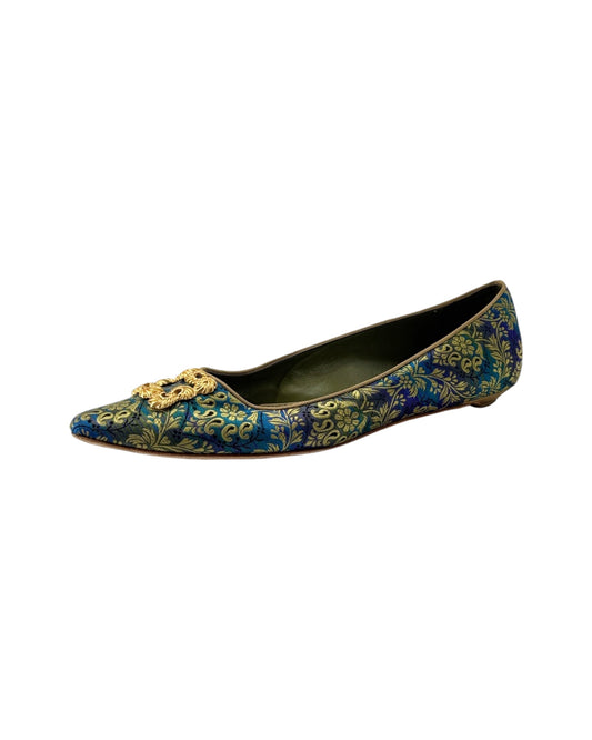 Decorative flat shoe with floral pattern on a white background