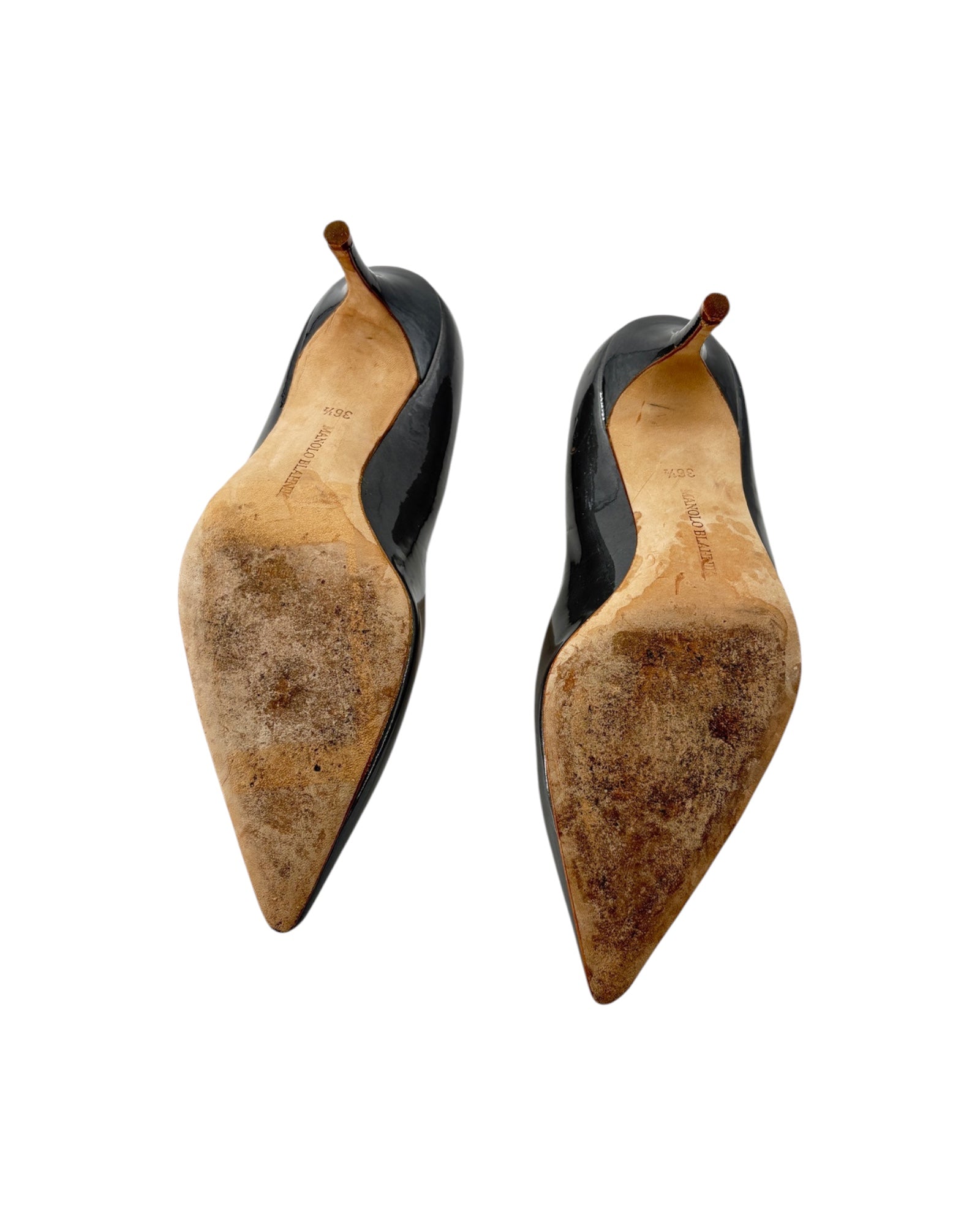 Pair of black high-heeled shoes with soles on a white background