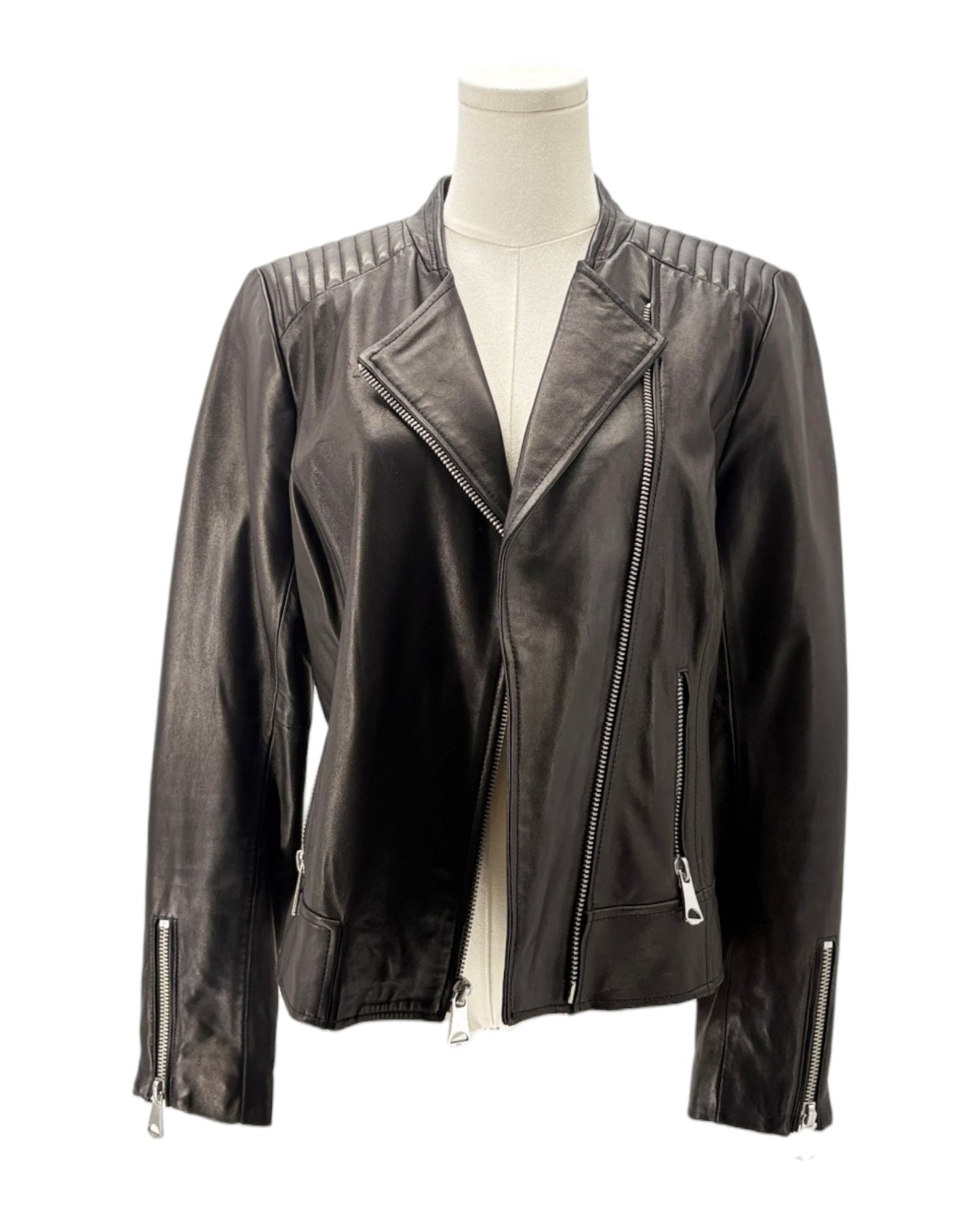 Black leather jacket on a mannequin against a white background