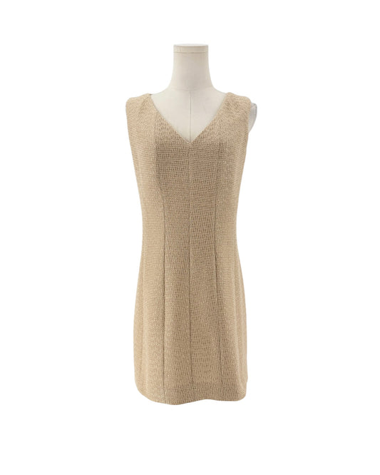 Tweed and metallic sleeveless mini dress on a mannequin on a white background