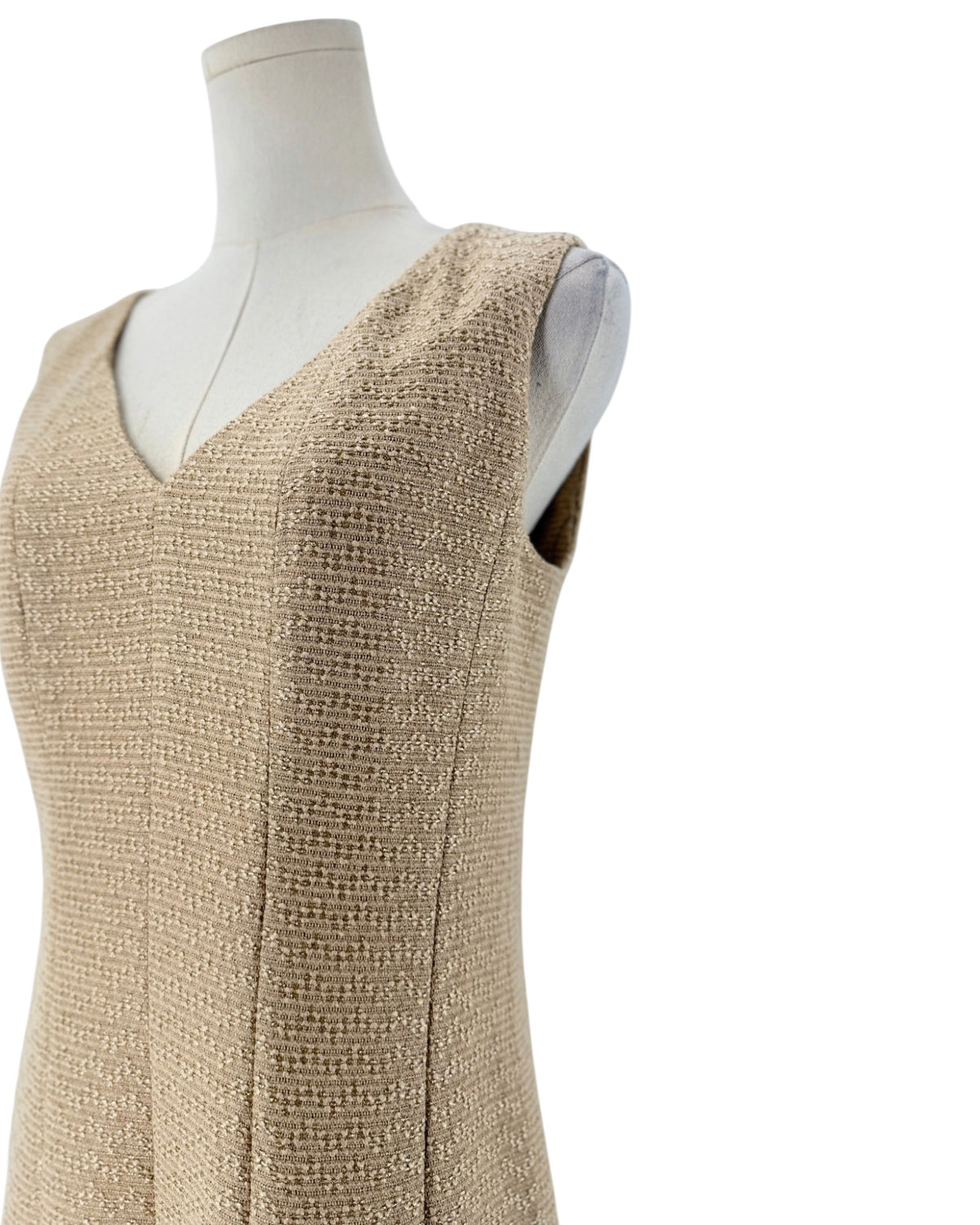 Tweed and metallic sleeveless mini dress on a mannequin on a white background