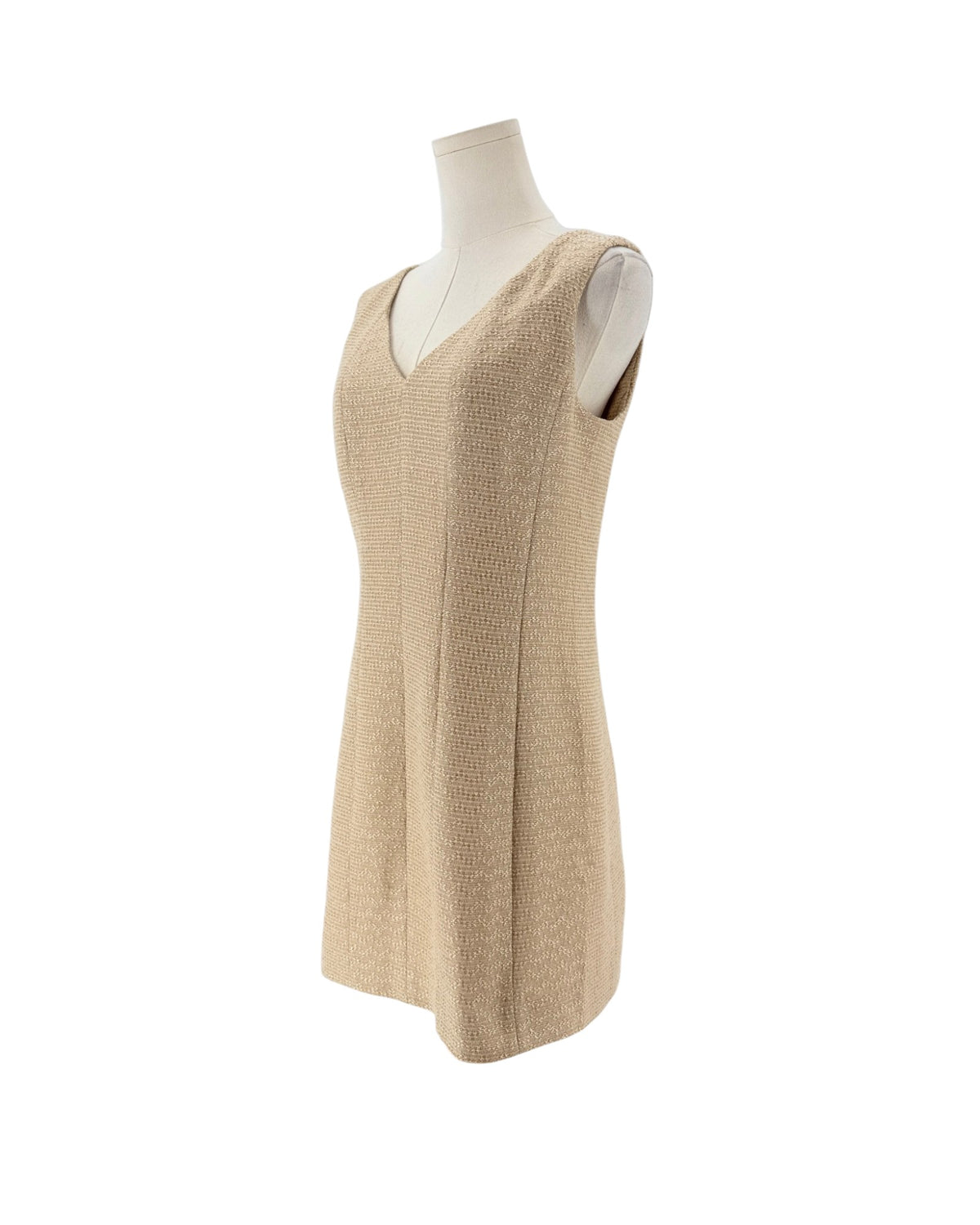 Tweed and metallic sleeveless mini dress on a mannequin on a white background