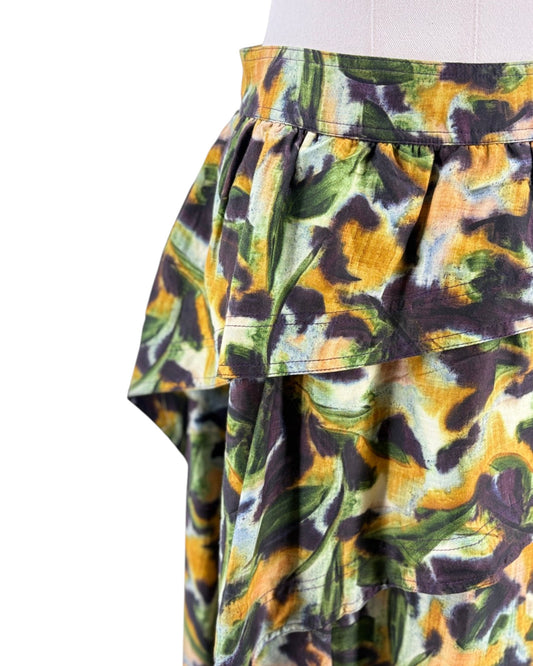 Colorful floral-patterned skirt on a mannequin against a white background