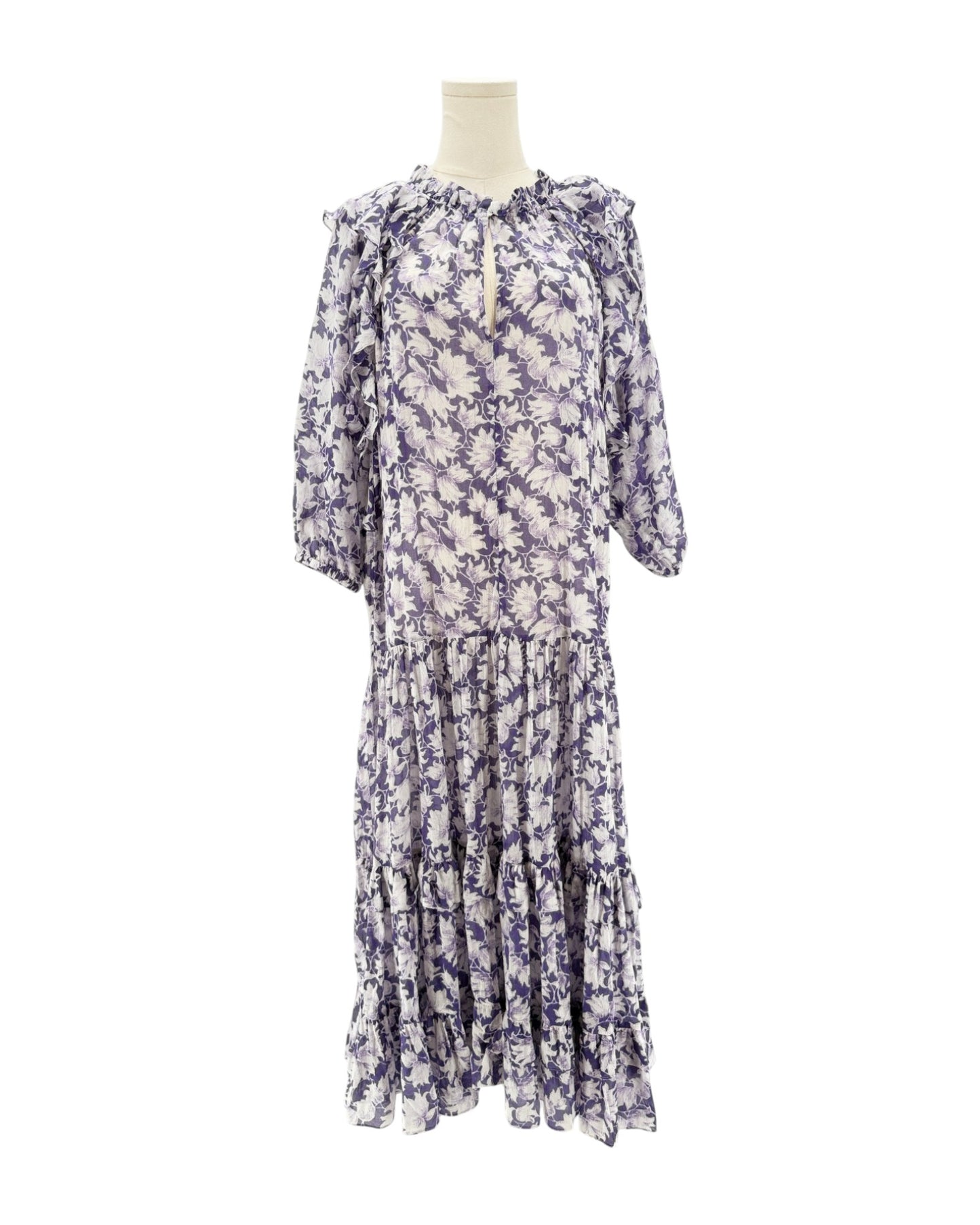 Floral dress on a mannequin against a white background