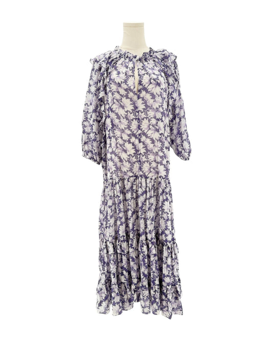 Floral dress on a mannequin against a white background
