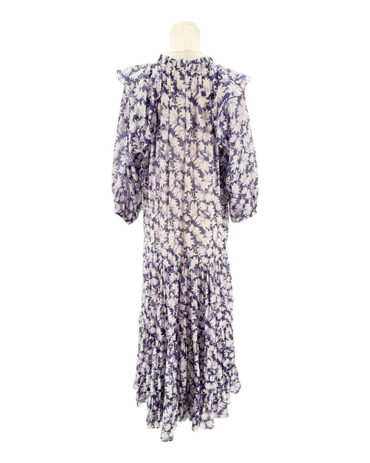 Floral dress on a mannequin against a white background