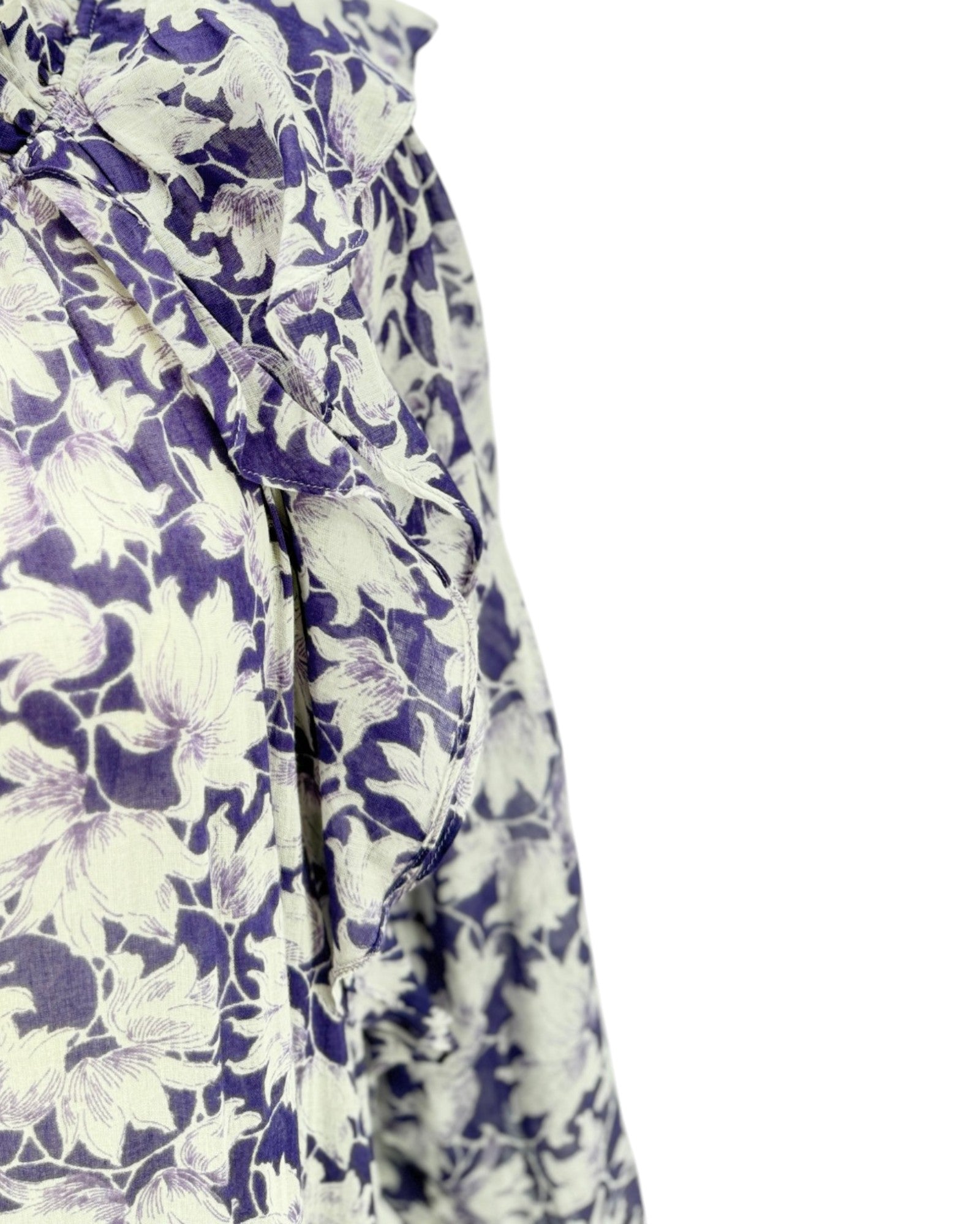Floral patterned fabric with purple and white flowers on a white background