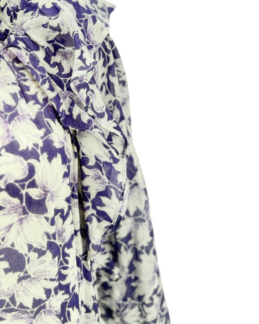 Floral patterned fabric with purple and white flowers on a white background