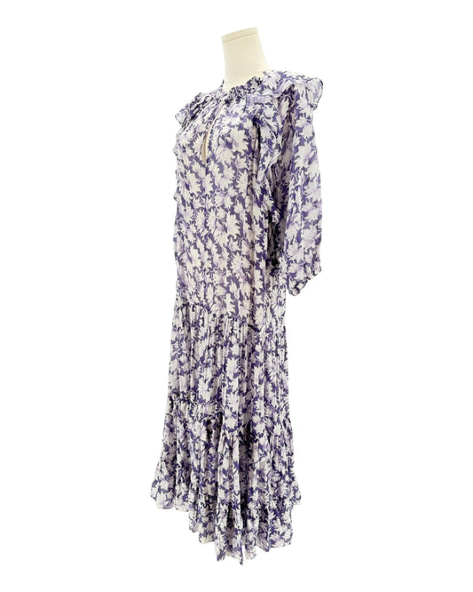 Floral dress on a mannequin against a white background