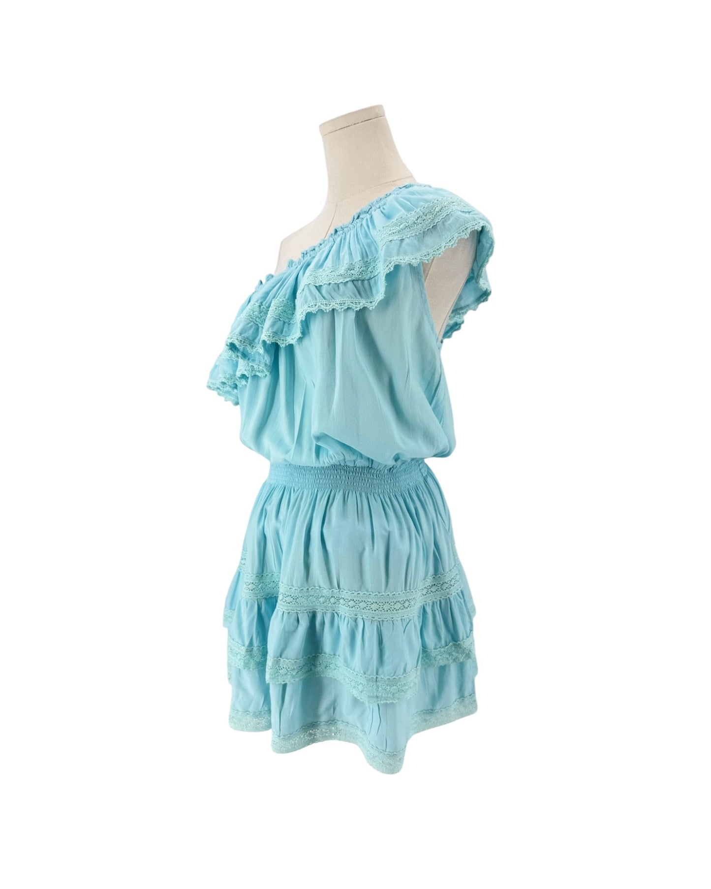 A light blue two-piece set consisting of an off-the-shoulder ruffled top and a matching tiered skirt, displayed on a mannequin torso against a white background.