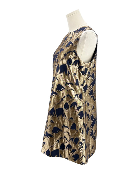 Gold sleeveless top with navy abstract pattern on a mannequin against a white background