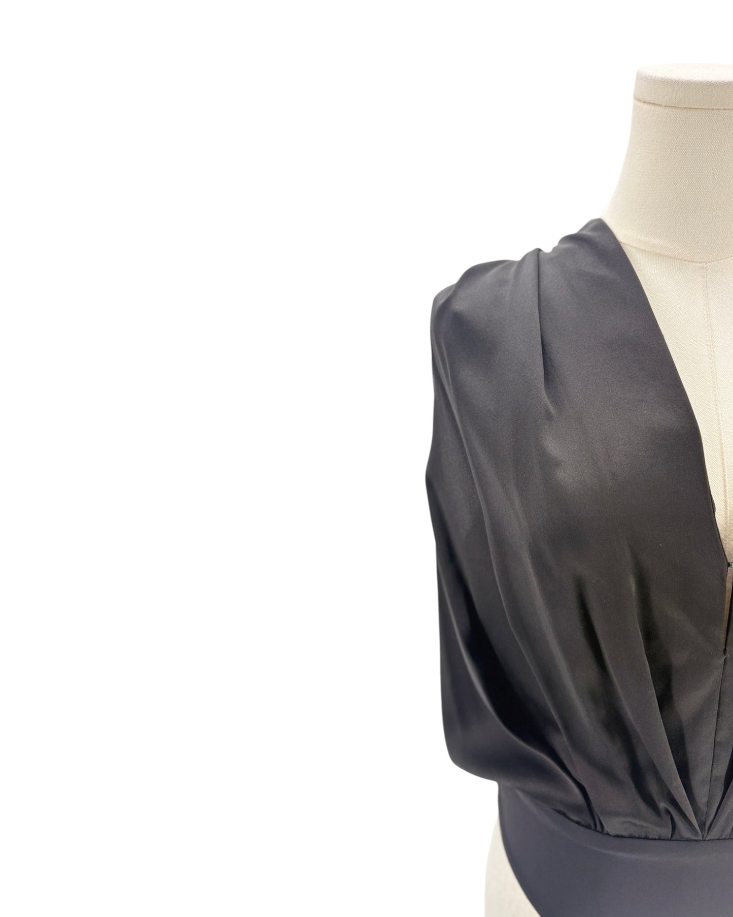 Black silk bodysuit on a mannequin on a white background