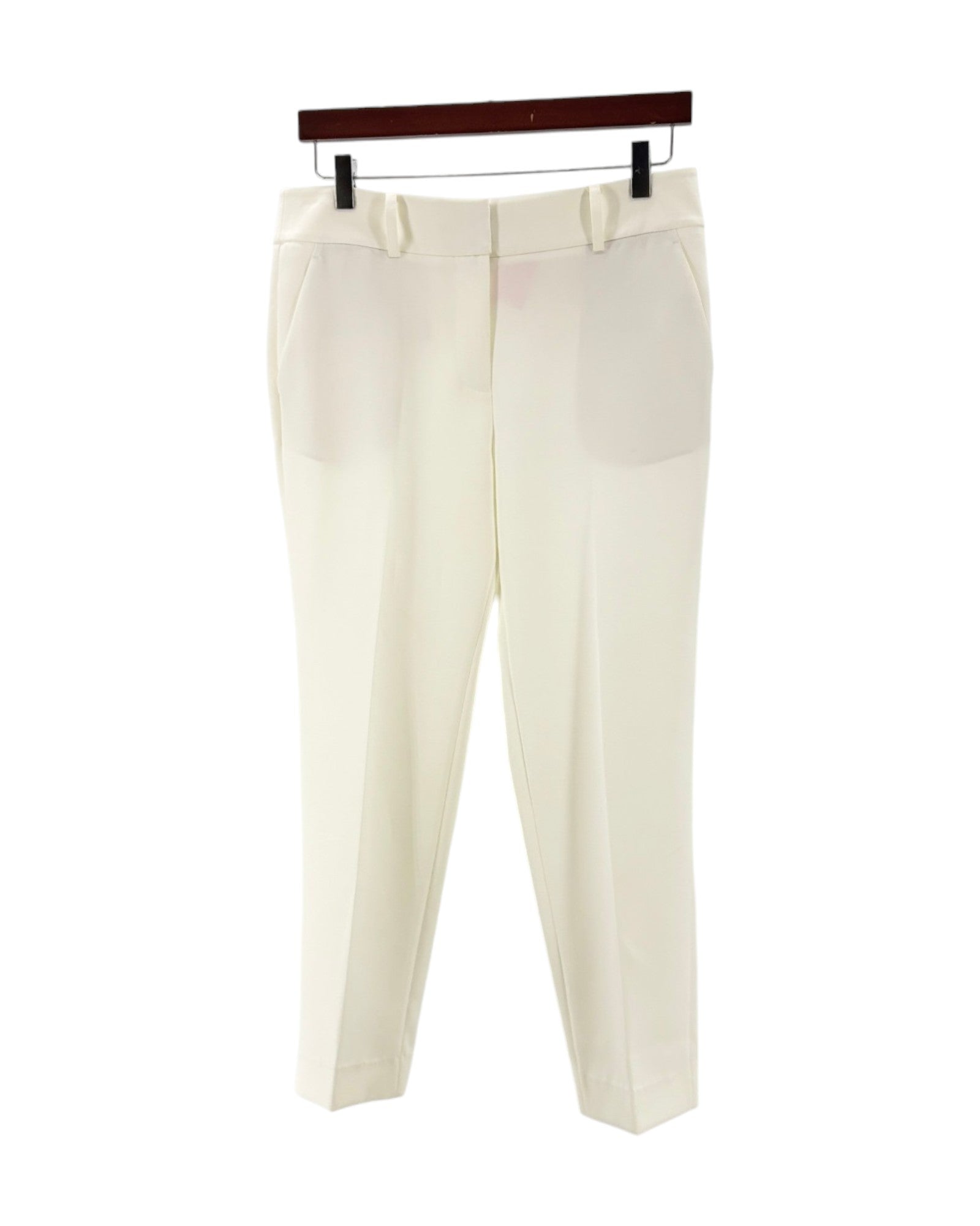 Cream colored trousers on a white background
