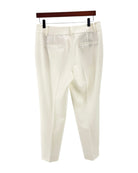 Cream colored trousers on a white background