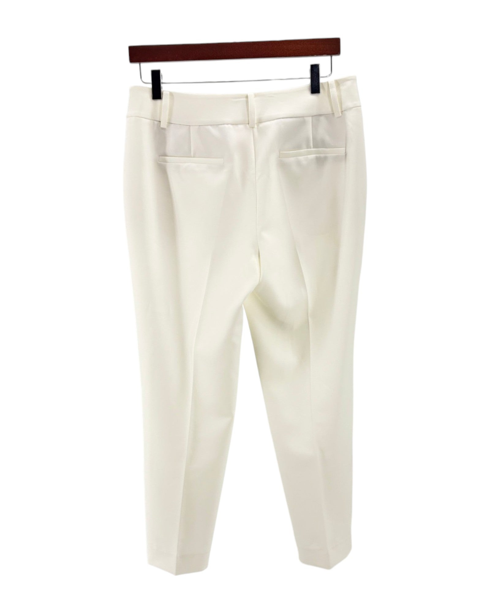 Cream colored trousers on a white background