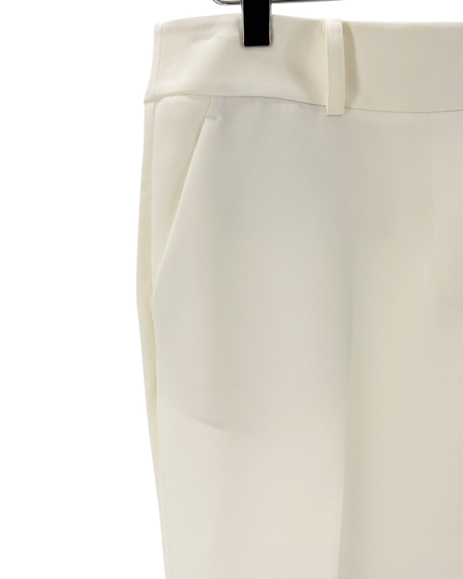 Cream colored trousers on a white background