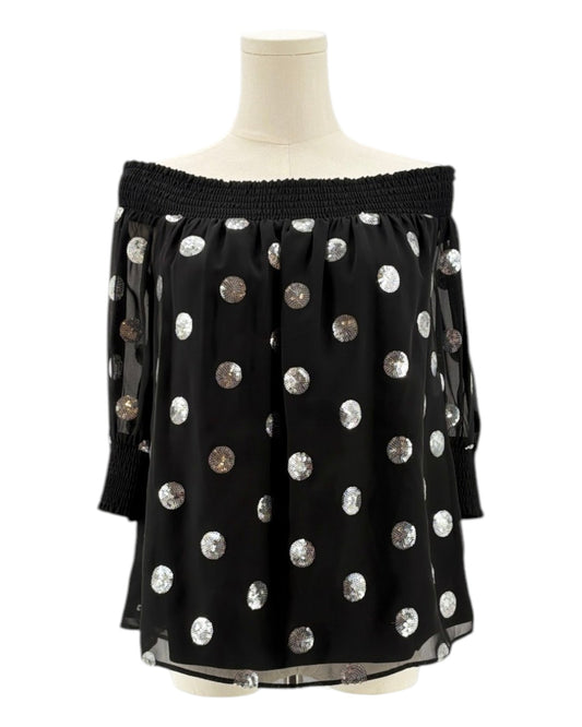 Milly black off-shoulder top with silver sequin polka dots on a mannequin against a white background