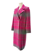 Plaid coat with pink and gray pattern on a mannequin against a white background