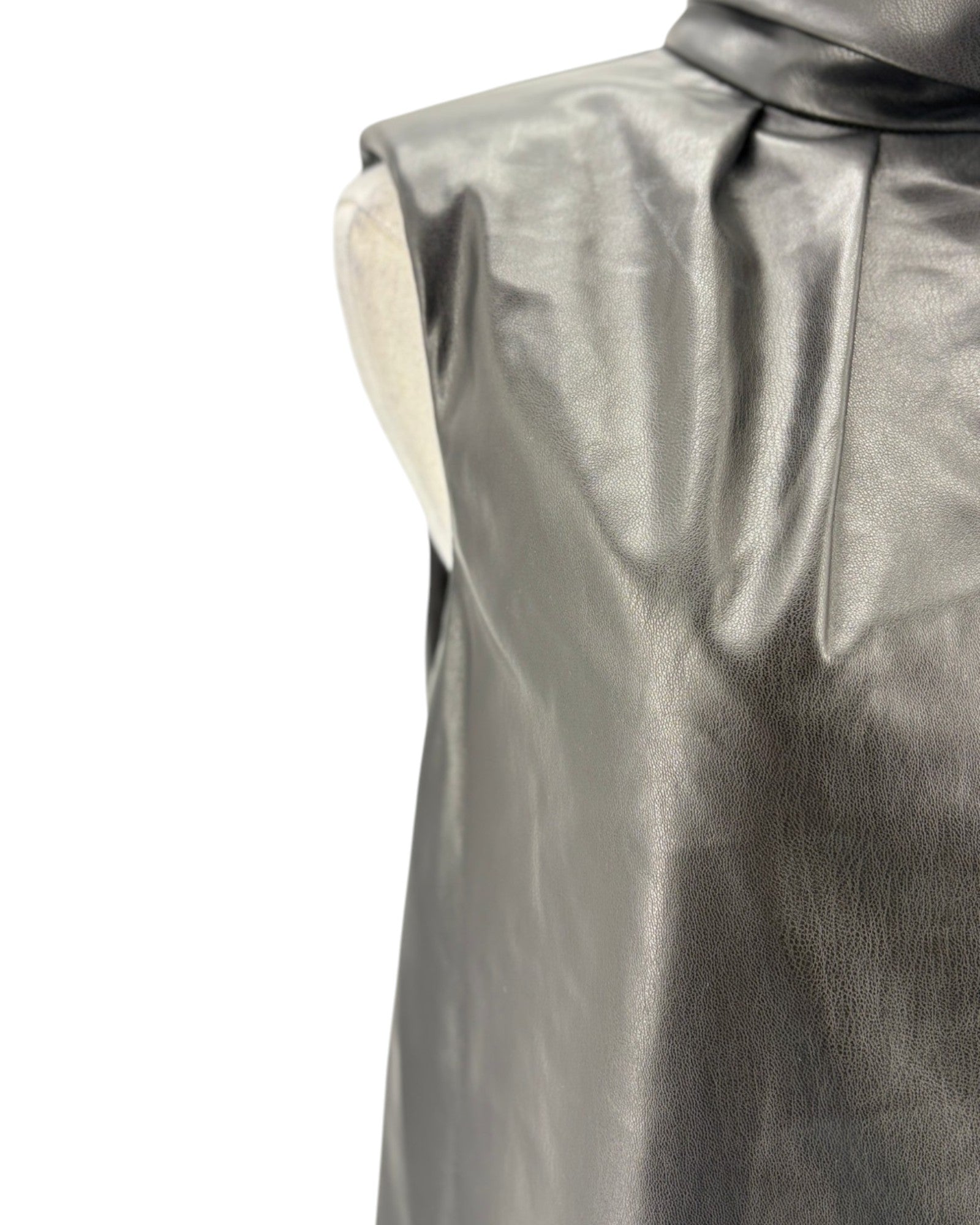 Close-up of a black vegan leather sleeveless top on a white background