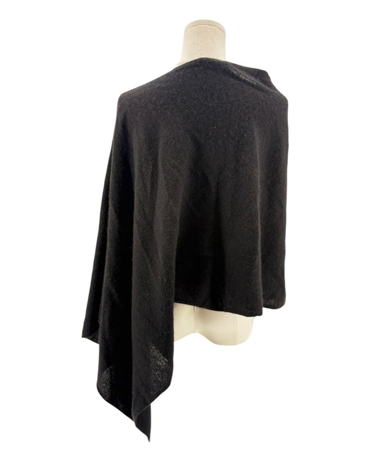 Black poncho on a mannequin against a white background