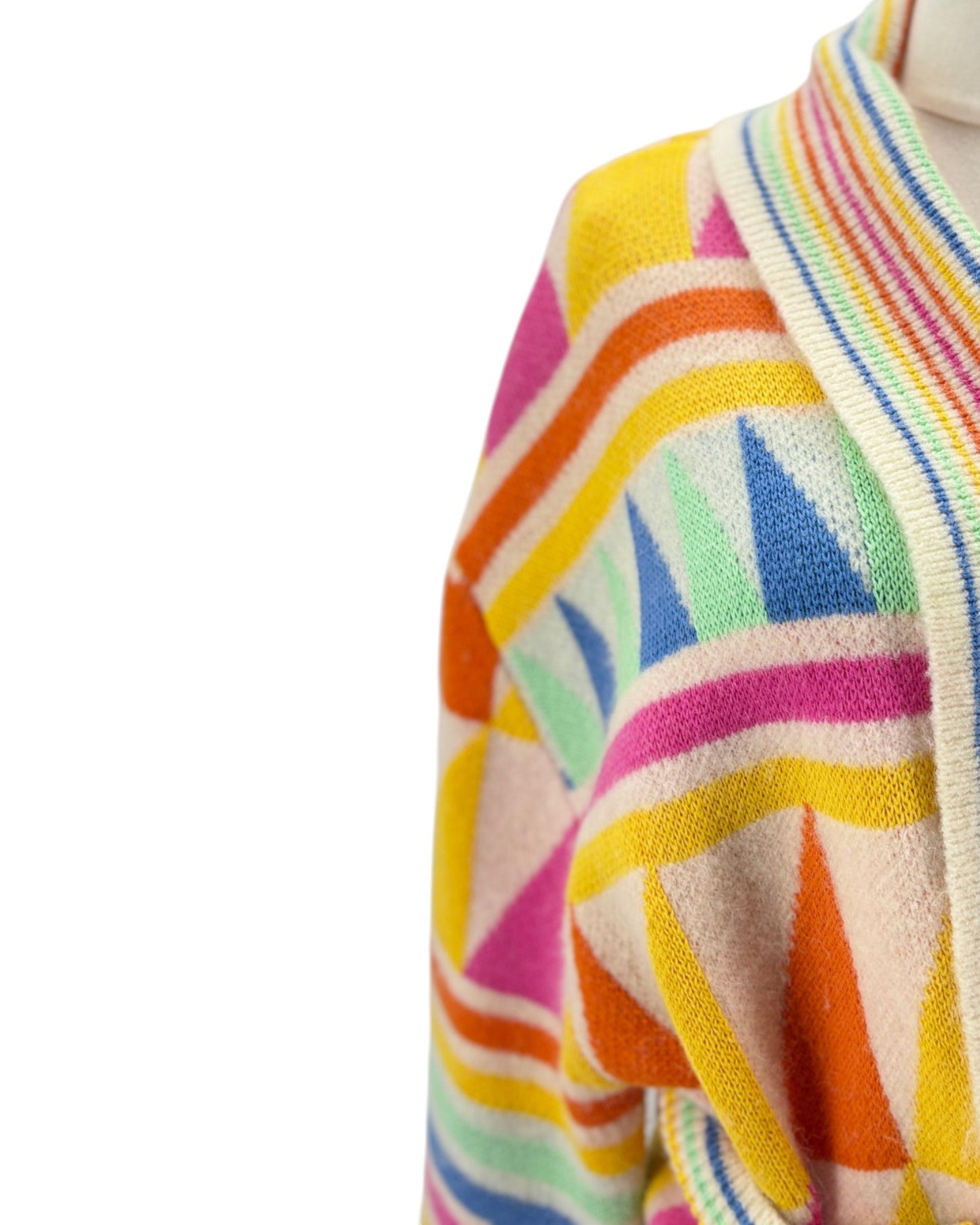 Close-up of a colorful striped sweater with a white background