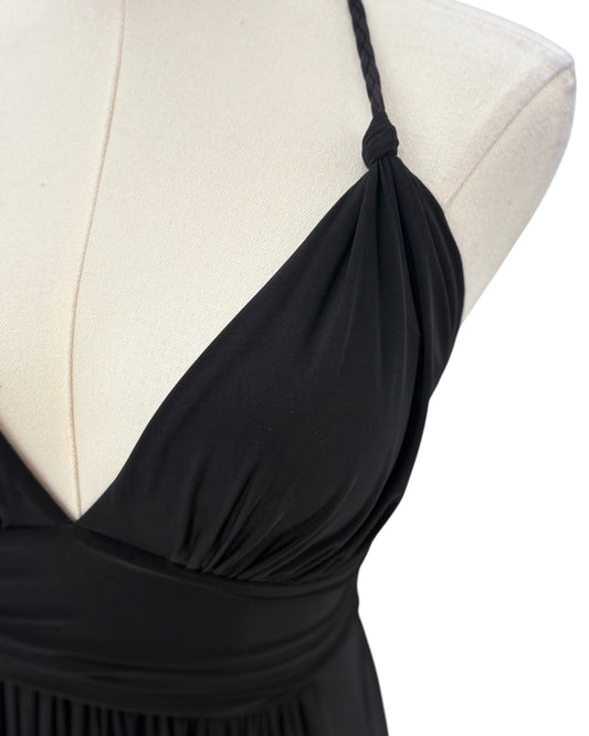 Black dress on a mannequin with a white background