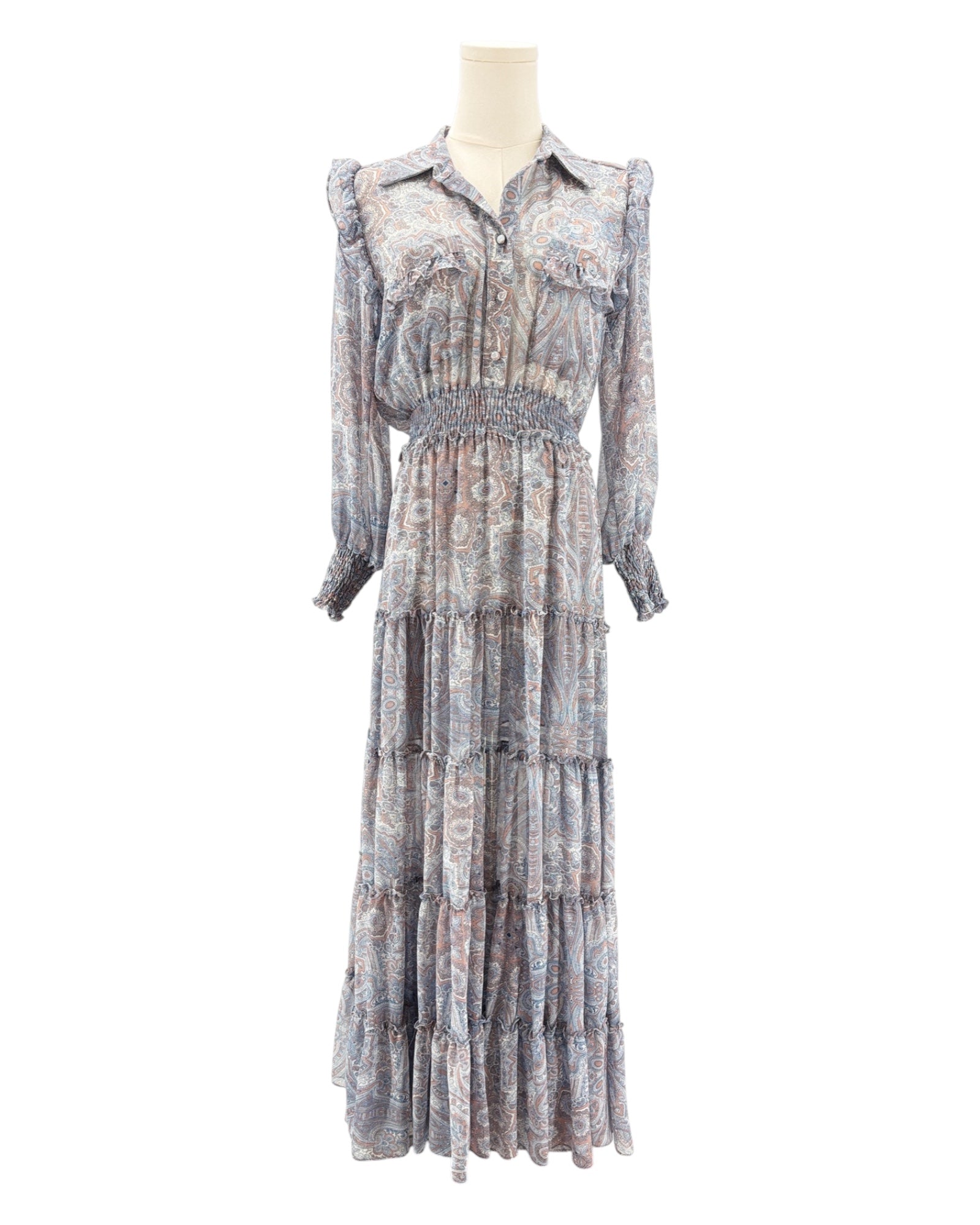 Long patterned dress on a mannequin against a white background