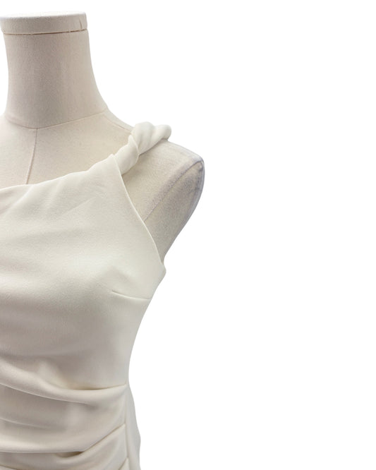 White dress on a mannequin against a white background