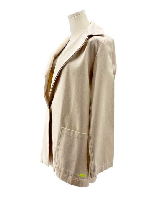 Beige jacket on a mannequin against a white background