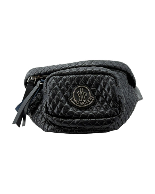 Black quilted waist bag with a brand logo on a white background